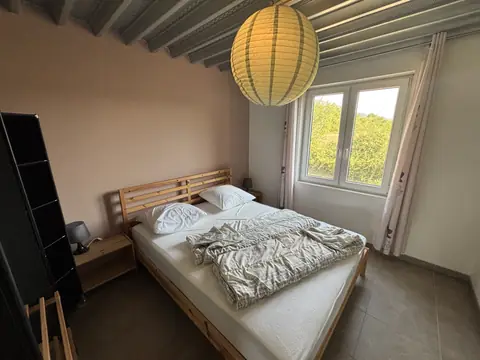 Første soveværelse med dobbeltseng i Gite 3